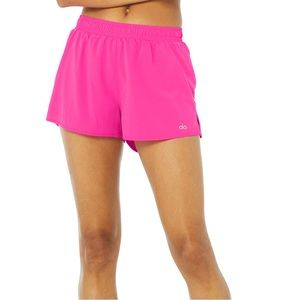 Hot pink ALO stride running shorts